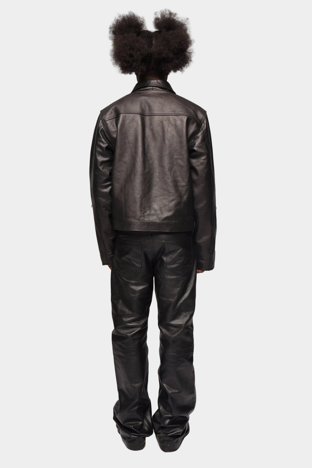 Black zipped leather jacket by Kaleb A. Bearden with a sleek design and silver zipper details.