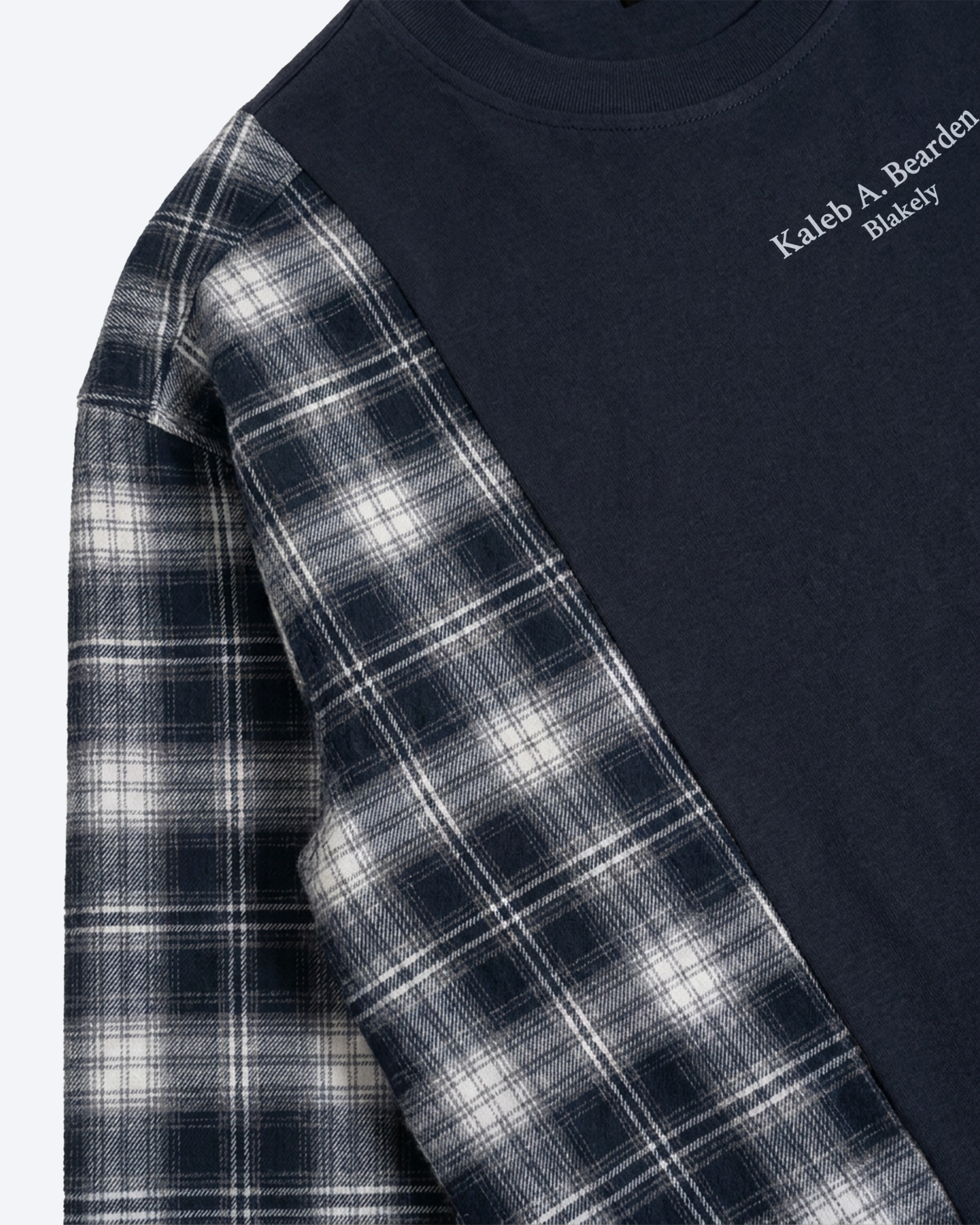 ODMPOD plaid panel long sleeve tee with a casual fit and classic plaid pattern, featuring a round neckline and long sleeves.