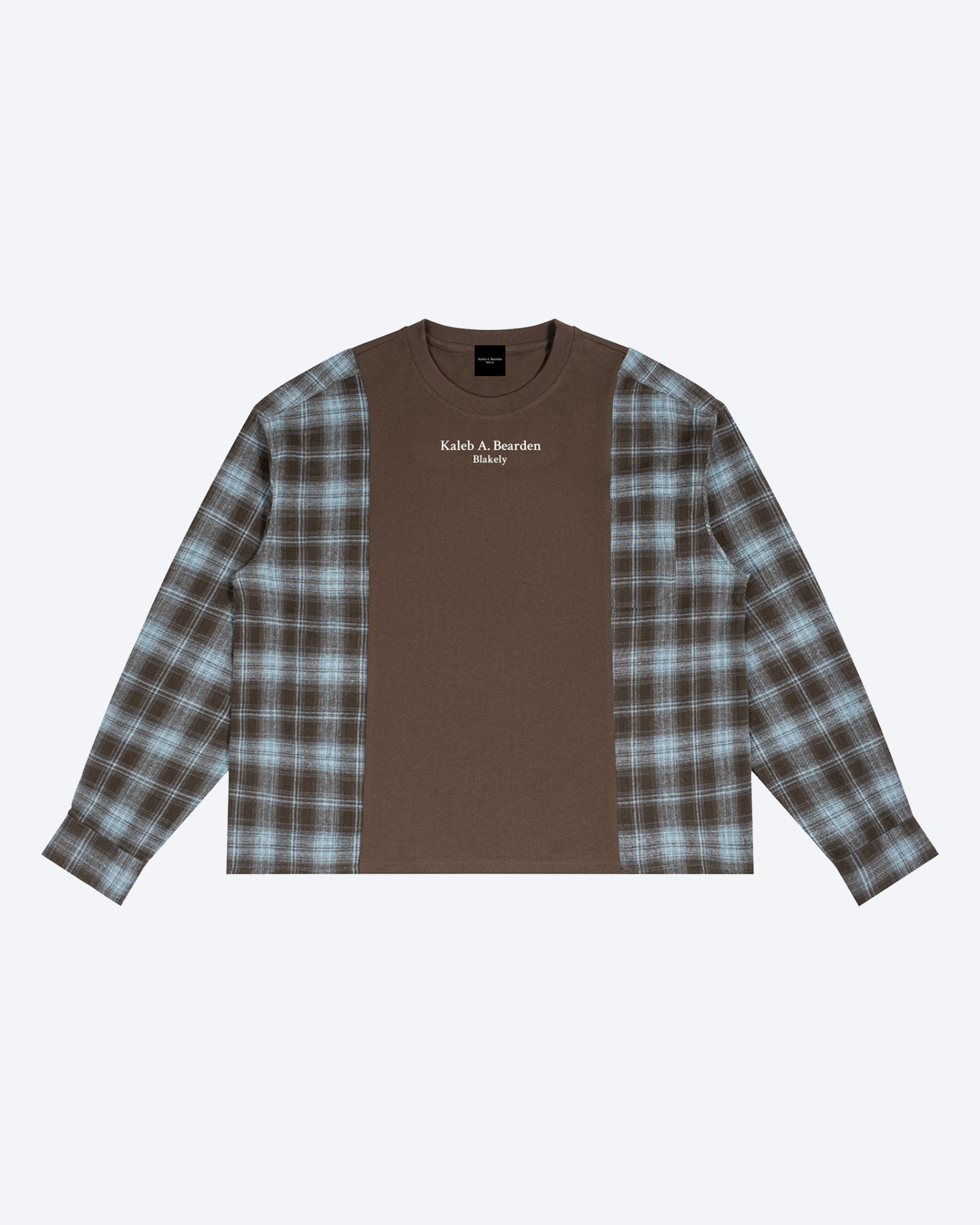 ODMPOD plaid panel long sleeve tee with a relaxed fit and casual style, featuring a plaid pattern on the sleeves and chest.