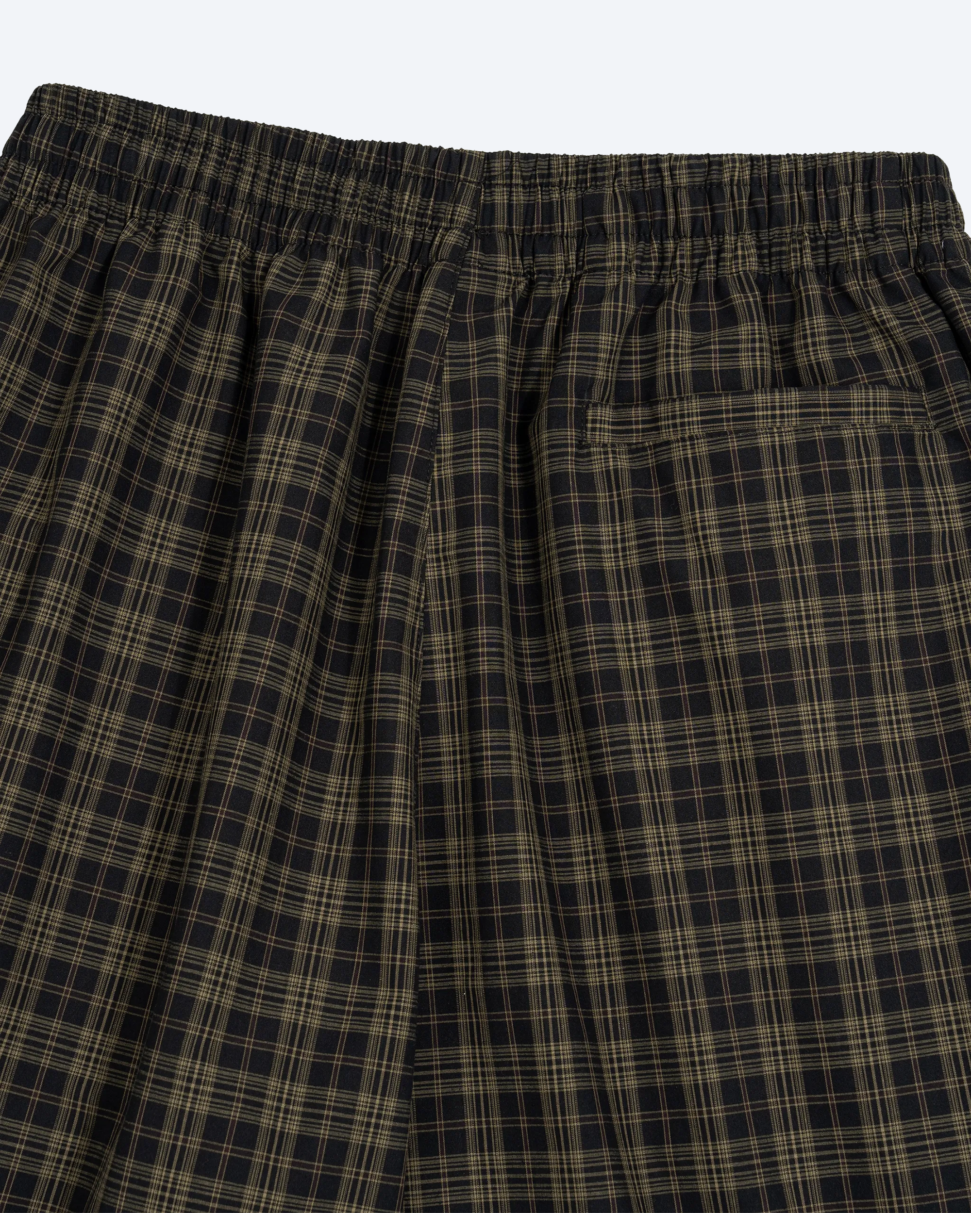 Olive plaid wide-leg shorts from ODMPOD featuring a relaxed fit and casual style, displayed on a plain background.