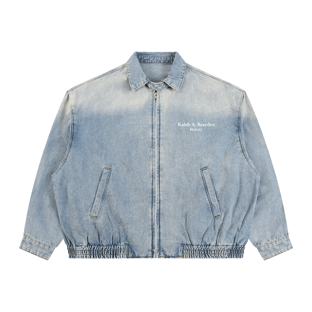 ODMPOD KAB Washed Blouson in light denim fabric, featuring a relaxed fit and button-front design, displayed on a hanger.