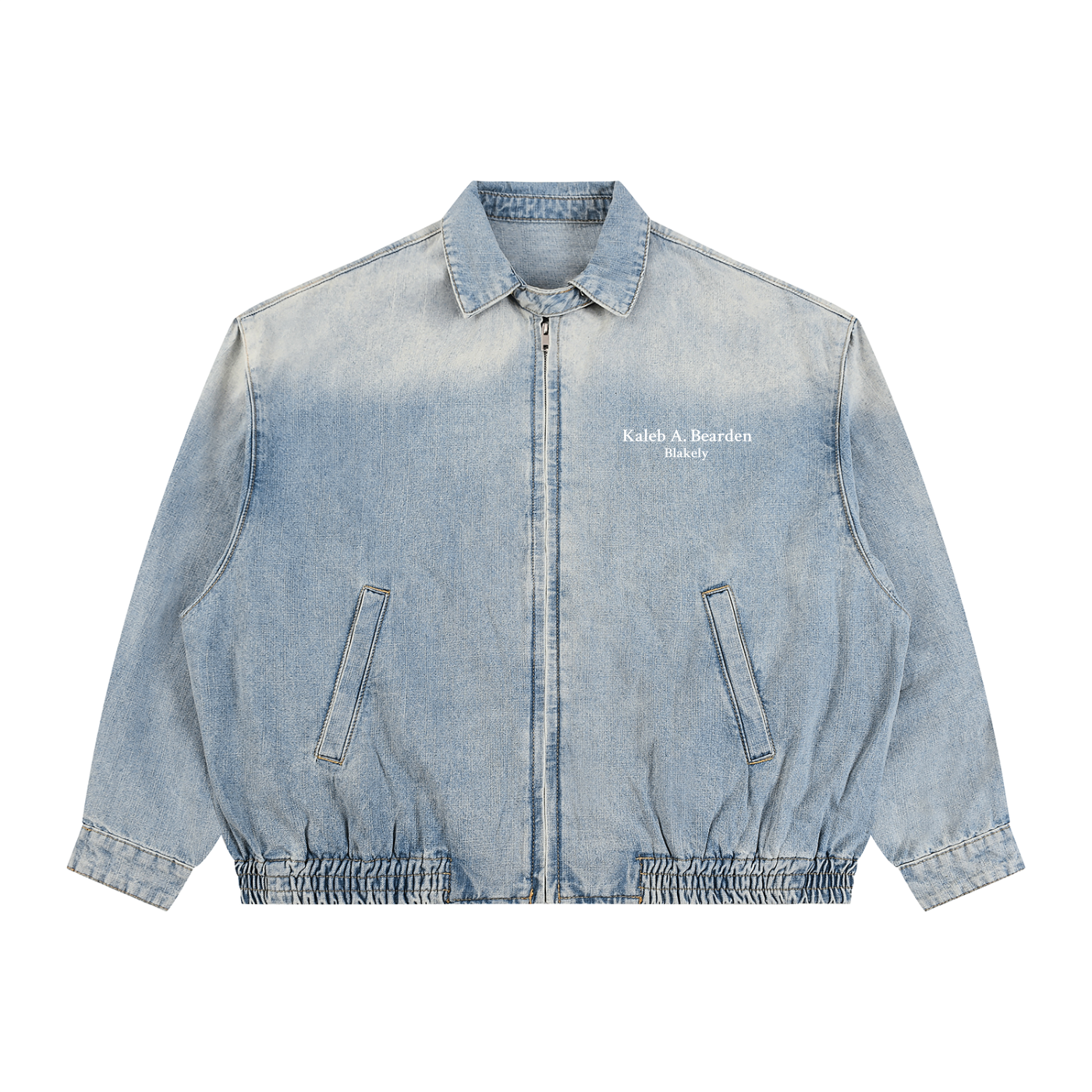 ODMPOD KAB Washed Blouson in light denim fabric, featuring a relaxed fit and button-front design, displayed on a hanger.