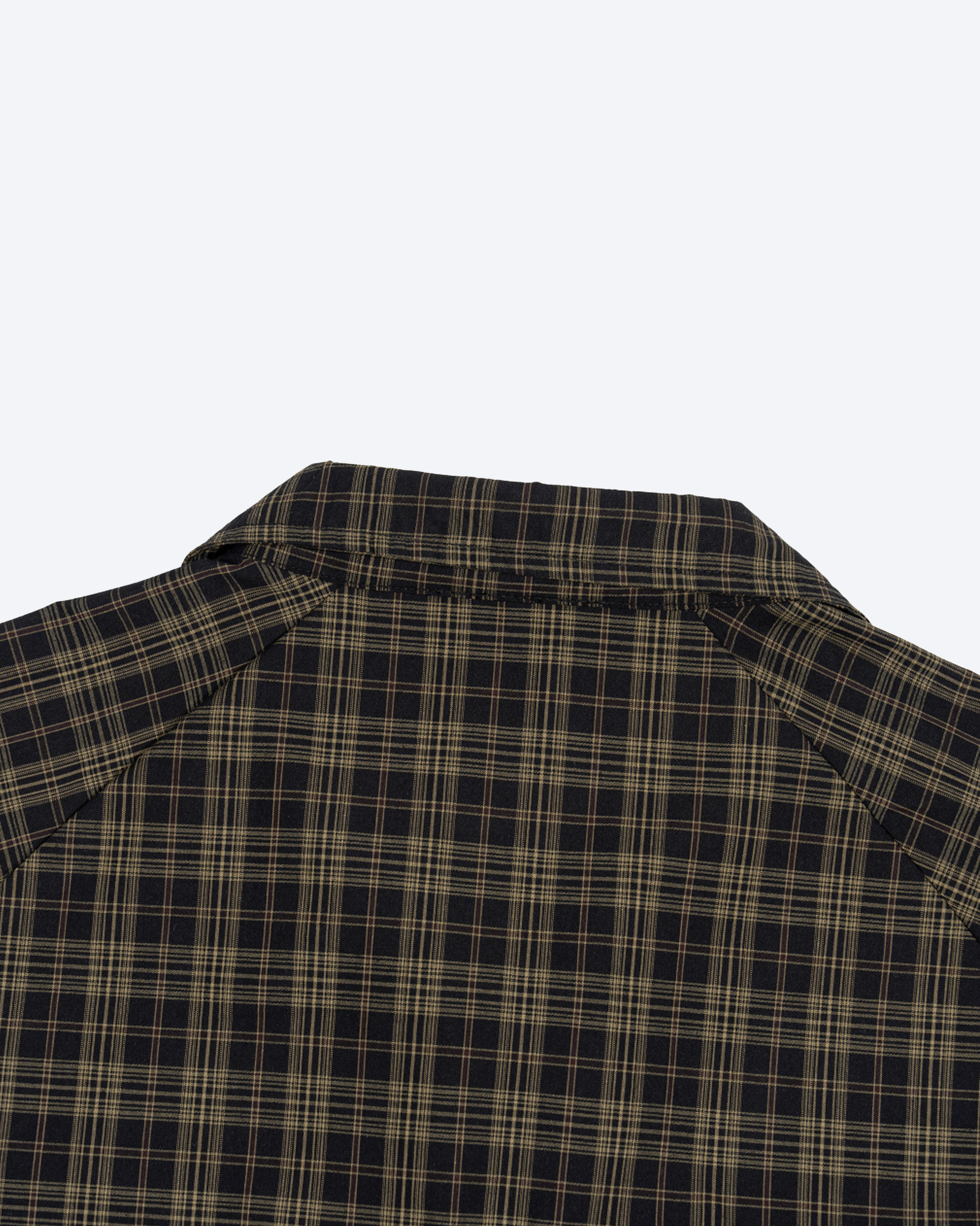 Olive plaid full-zip track jacket by ODMPOD, shown with front view and zip closure, made from comfortable athletic fabric.