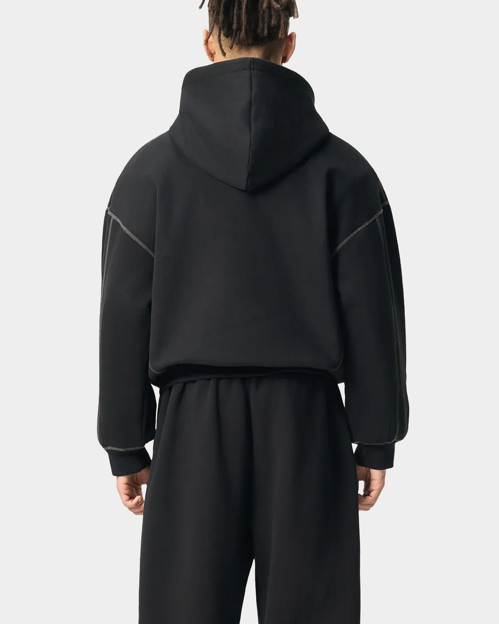 Black ODMPOD BB Monogram Contrast Hoodie with bold logo print and contrasting hood lining, casual streetwear style.