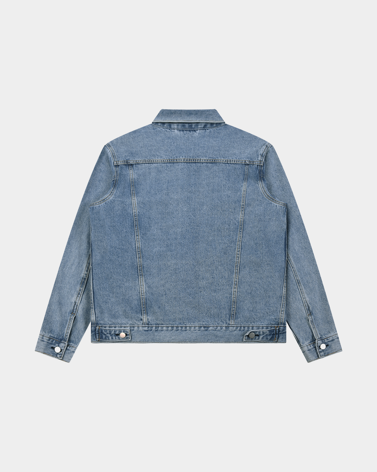 ODMPOD heavyweight denim trucker jacket with classic design, button-front closure, and chest pockets, shown on a hanger.