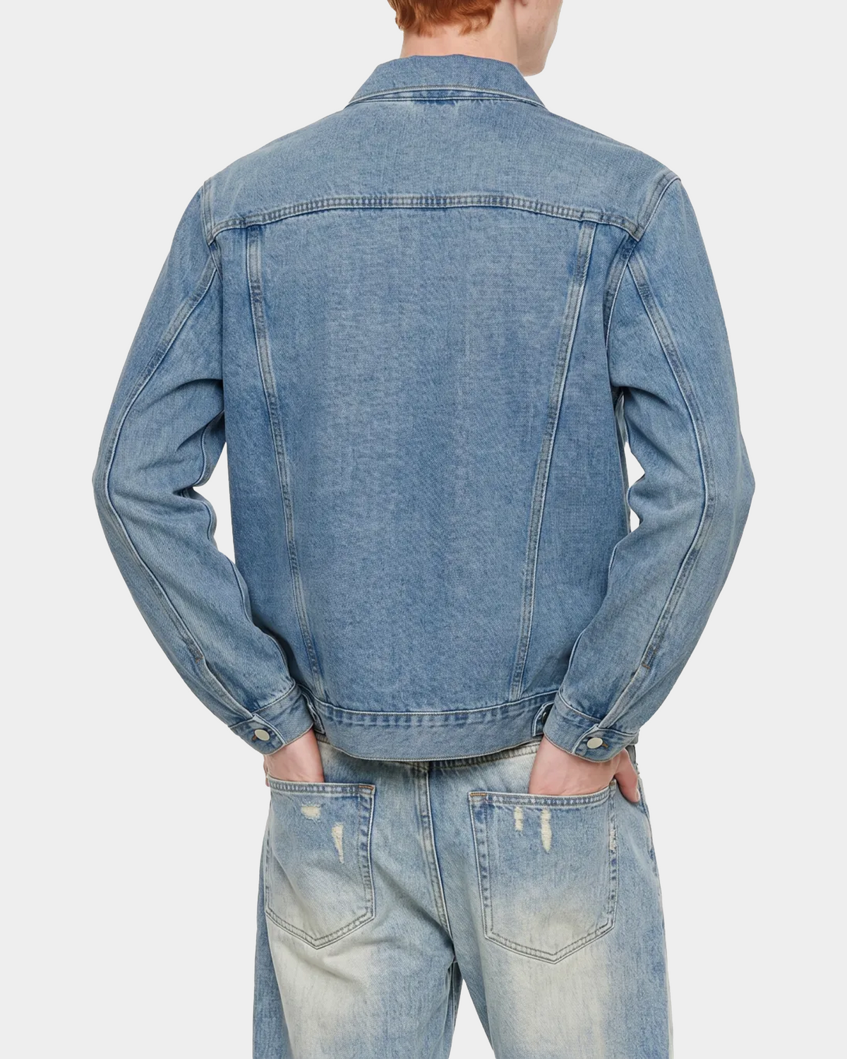 ODMPOD heavyweight denim trucker jacket showing classic collar, button front, and rugged denim fabric on a white background.