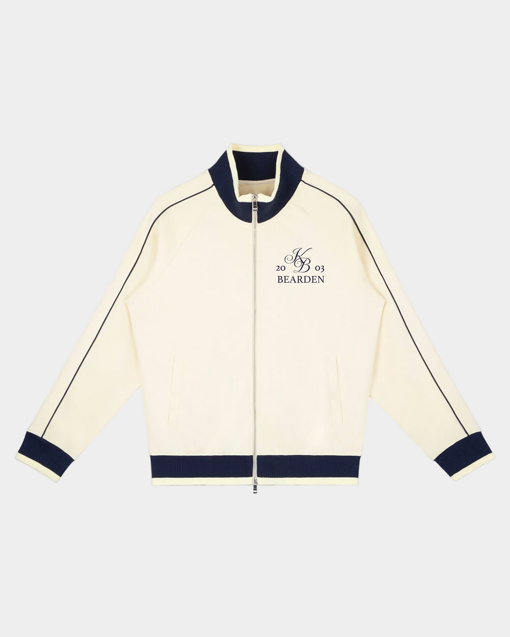 ODMPOD Home Blues Track Jacket in navy blue with white stripes, featuring a zip-up front and sporty design.