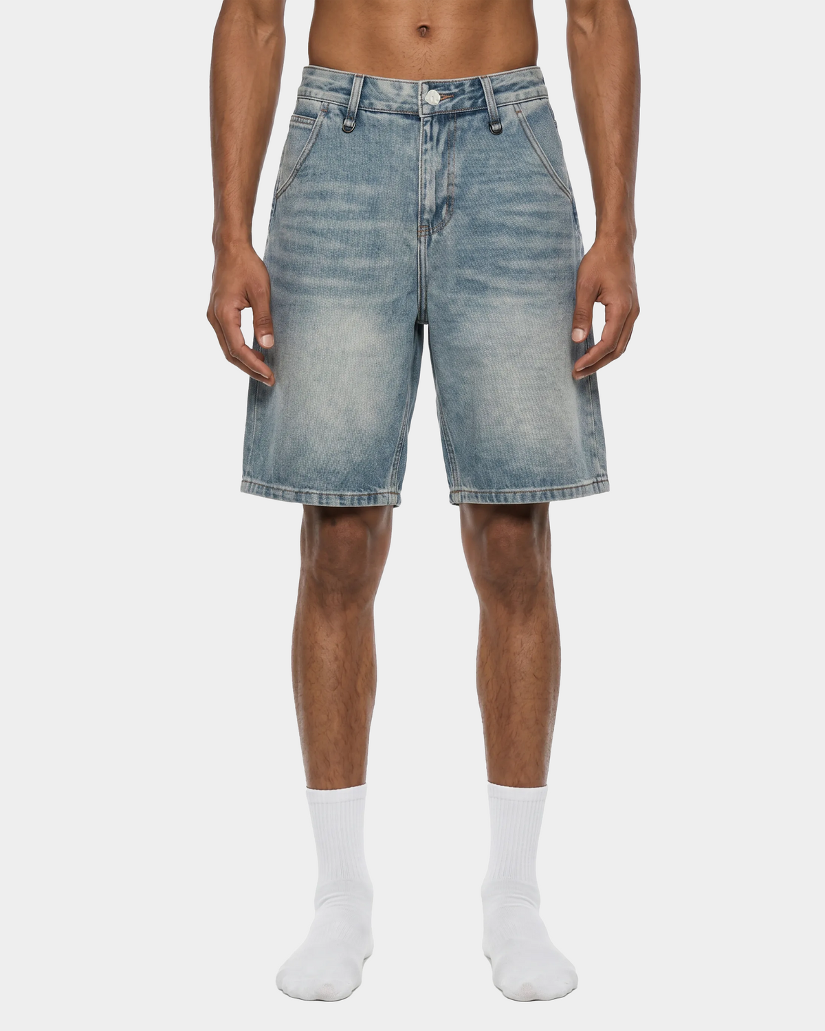 Faded blue denim shorts by ODMPOD with distressed details and rolled hems, casual summer style for women.