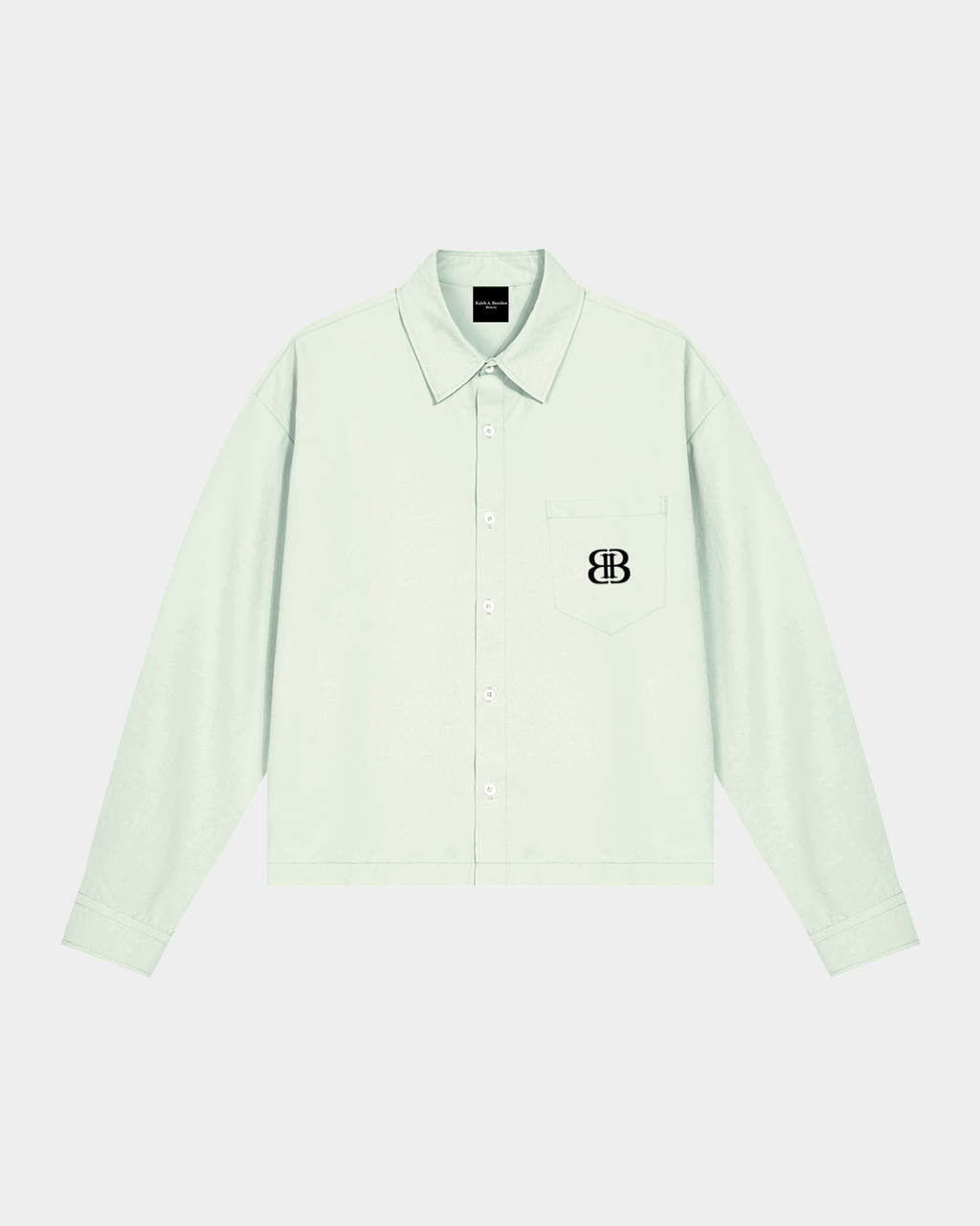 ODMPOD BB Mint Drop Shoulder Shirt displayed on a hanger, featuring a soft mint green color and relaxed fit design.