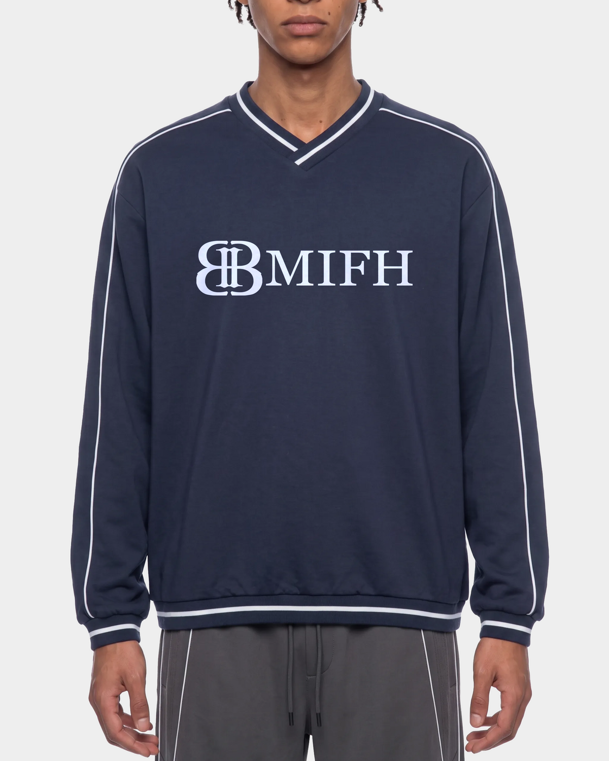ODMPOD Monogram Raglan Pullover featuring a stylish monogram design on a cozy, casual sweatshirt with contrasting sleeves.