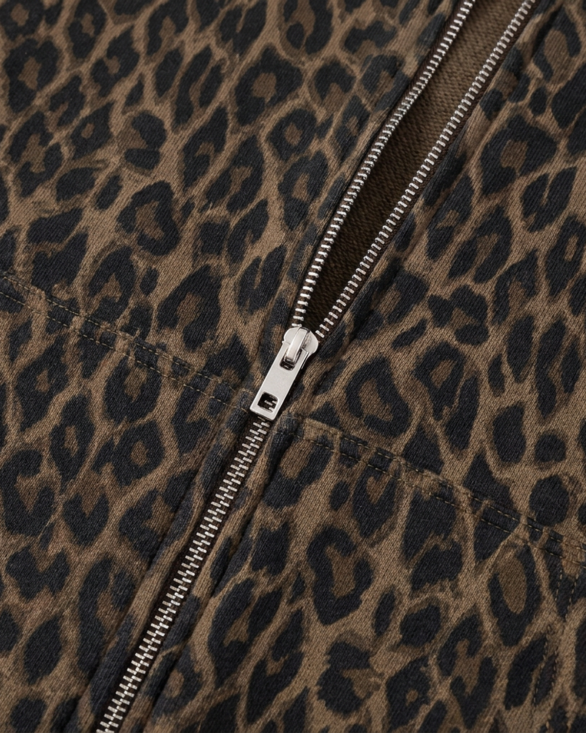 ODMPOD BB Leopard Stripe Zip Hoodie featuring black and white animal print pattern and a front zipper, casual streetwear style.