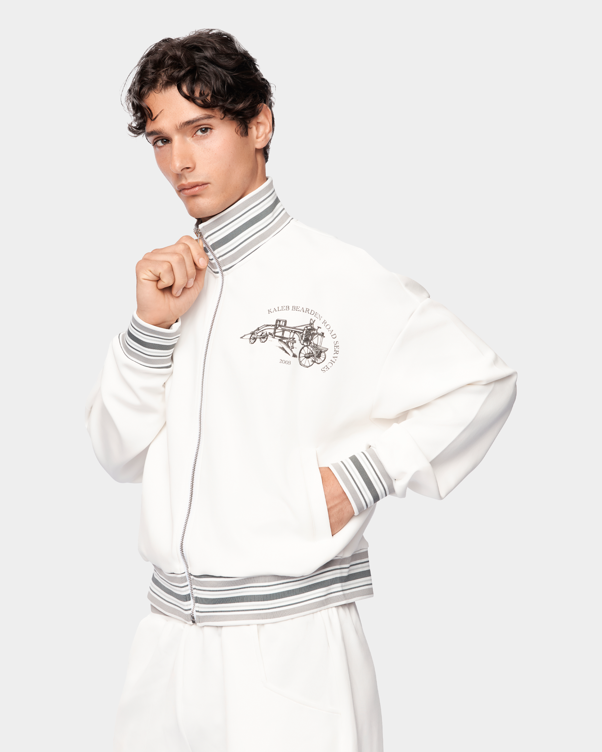 Kaleb A. Bearden Signature Track Jacket in black with white stripes, featuring a zip-up front and athletic fit.
