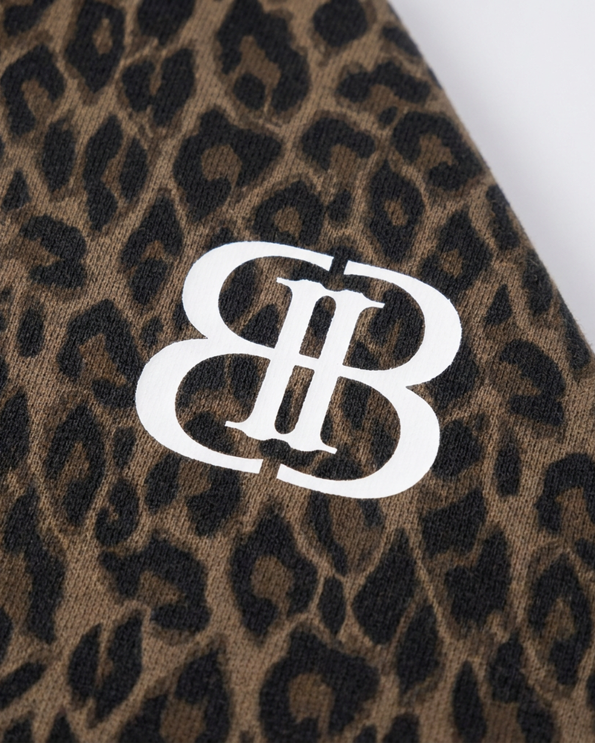 ODMPOD BB Leopard Stripe Zip Hoodie showing leopard and stripe pattern, front view with zip closure and hood.