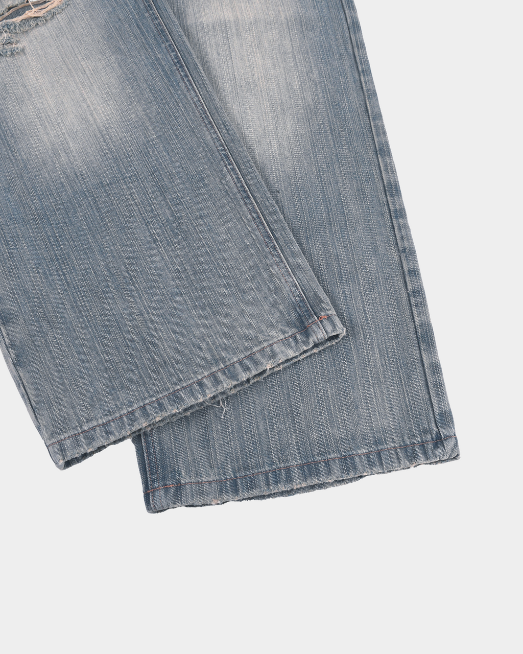 Kaleb A. Bearden monogram brushed denim pants with subtle logo embroidery and relaxed fit, showing the front view.