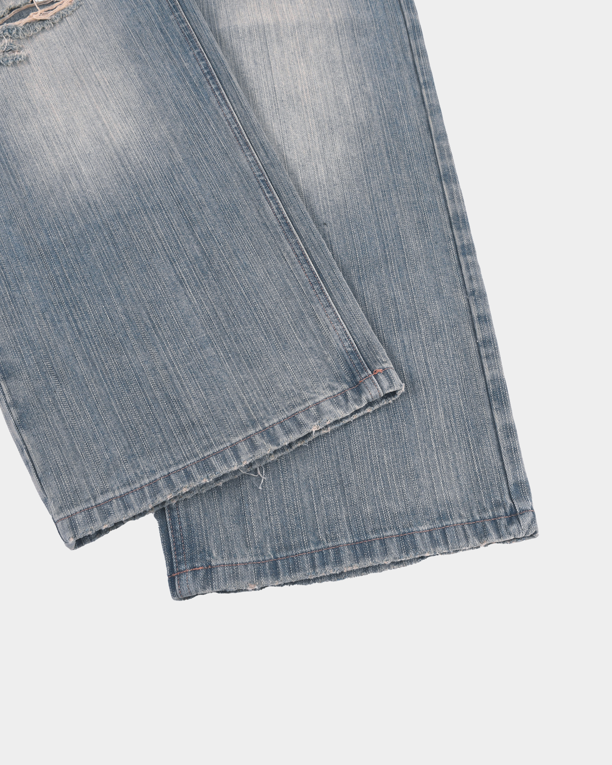 Kaleb A. Bearden monogram brushed denim pants with subtle logo embroidery and relaxed fit, showing the front view.
