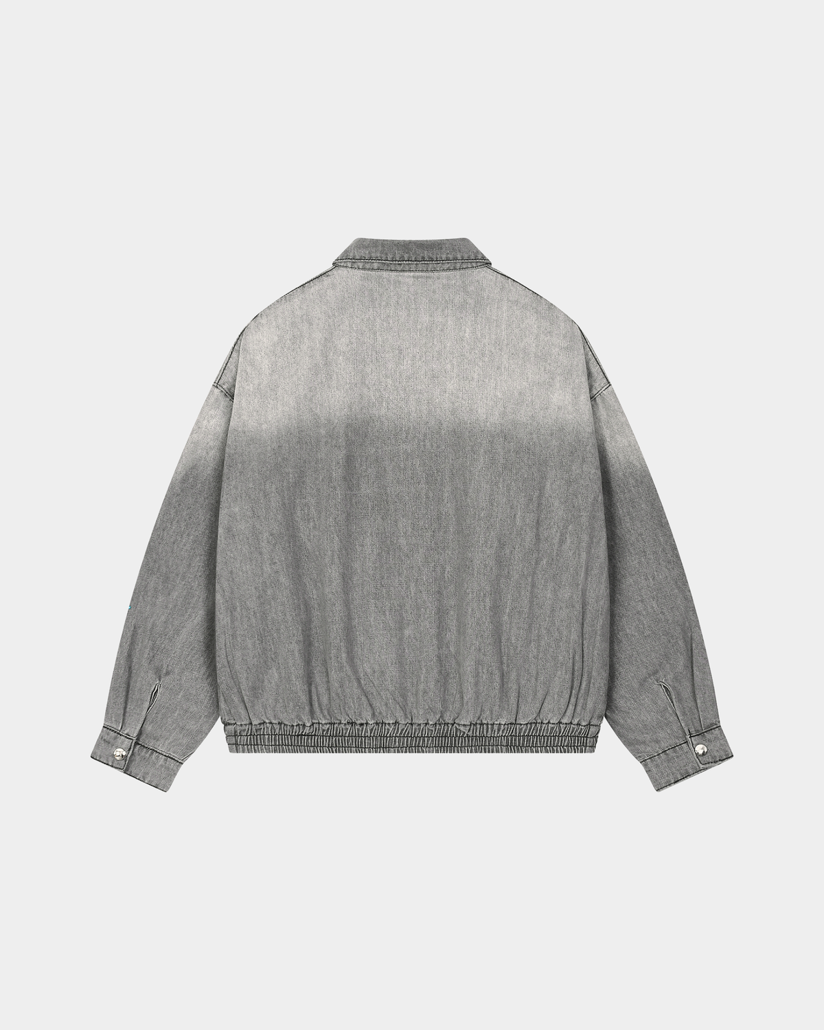 ODMPOD KAB Washed Blouson in light denim, featuring a relaxed fit with distressed details and adjustable waist straps.