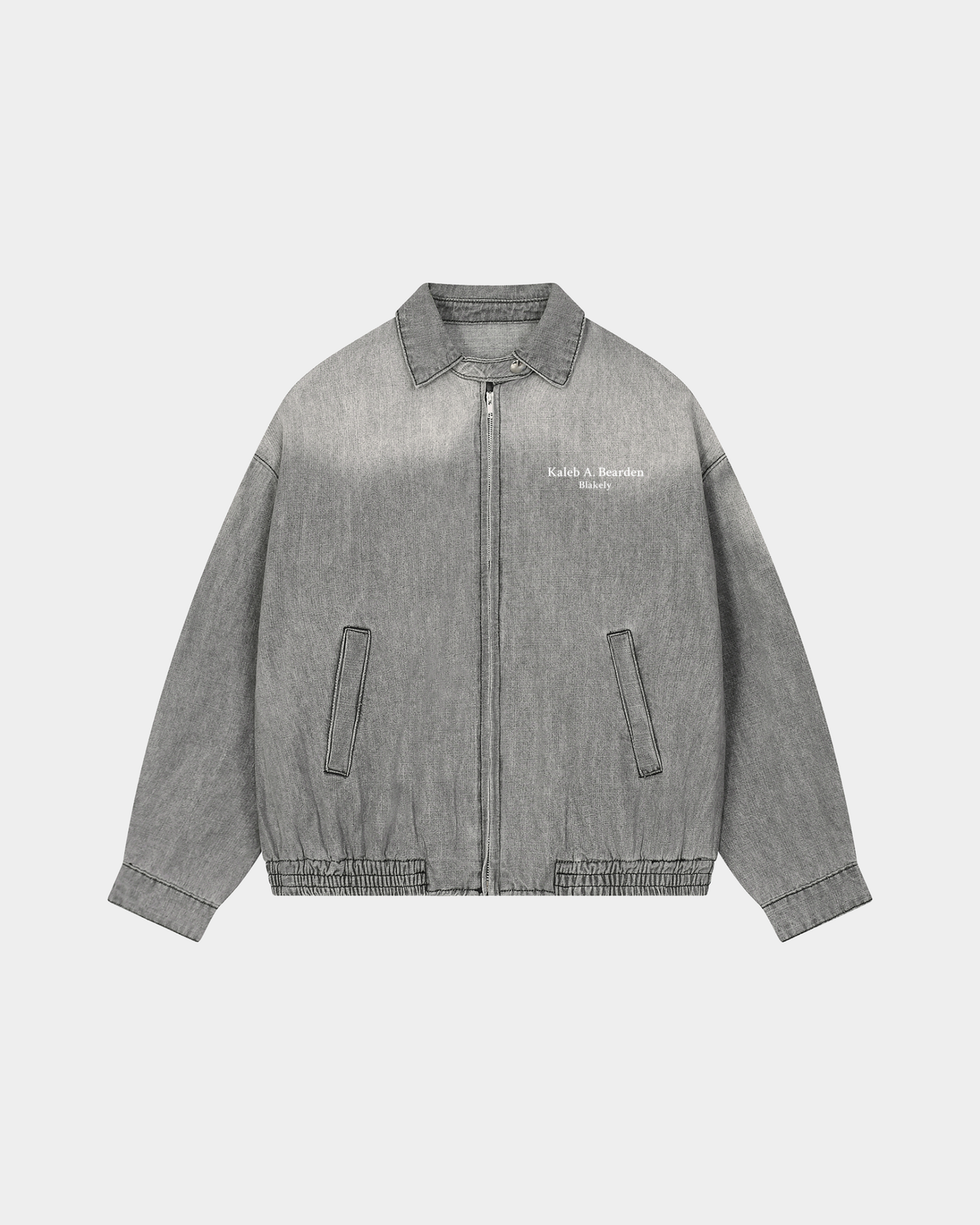 ODMPOD KAB Washed Blouson jacket in light denim with a relaxed fit and button-up front, displayed on a hanger.