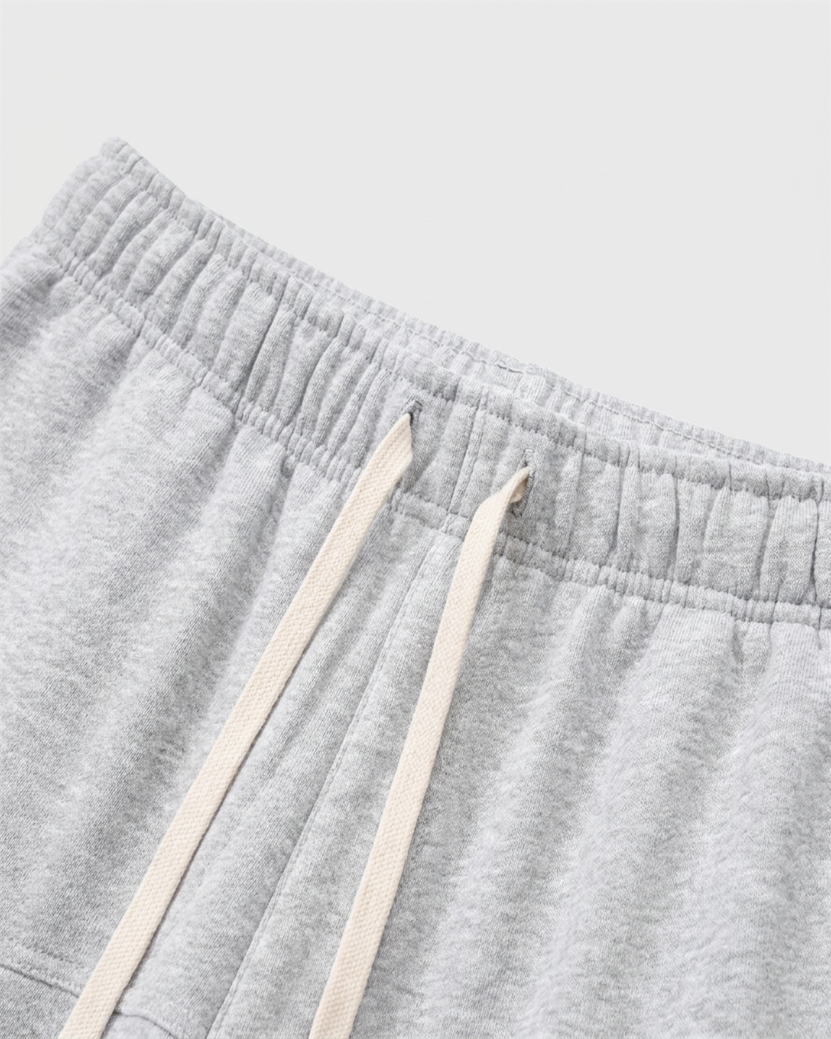 ODMPOD R.S fleece sweatpants in gray, featuring a comfortable fit and elastic waistband, shown on a mannequin.