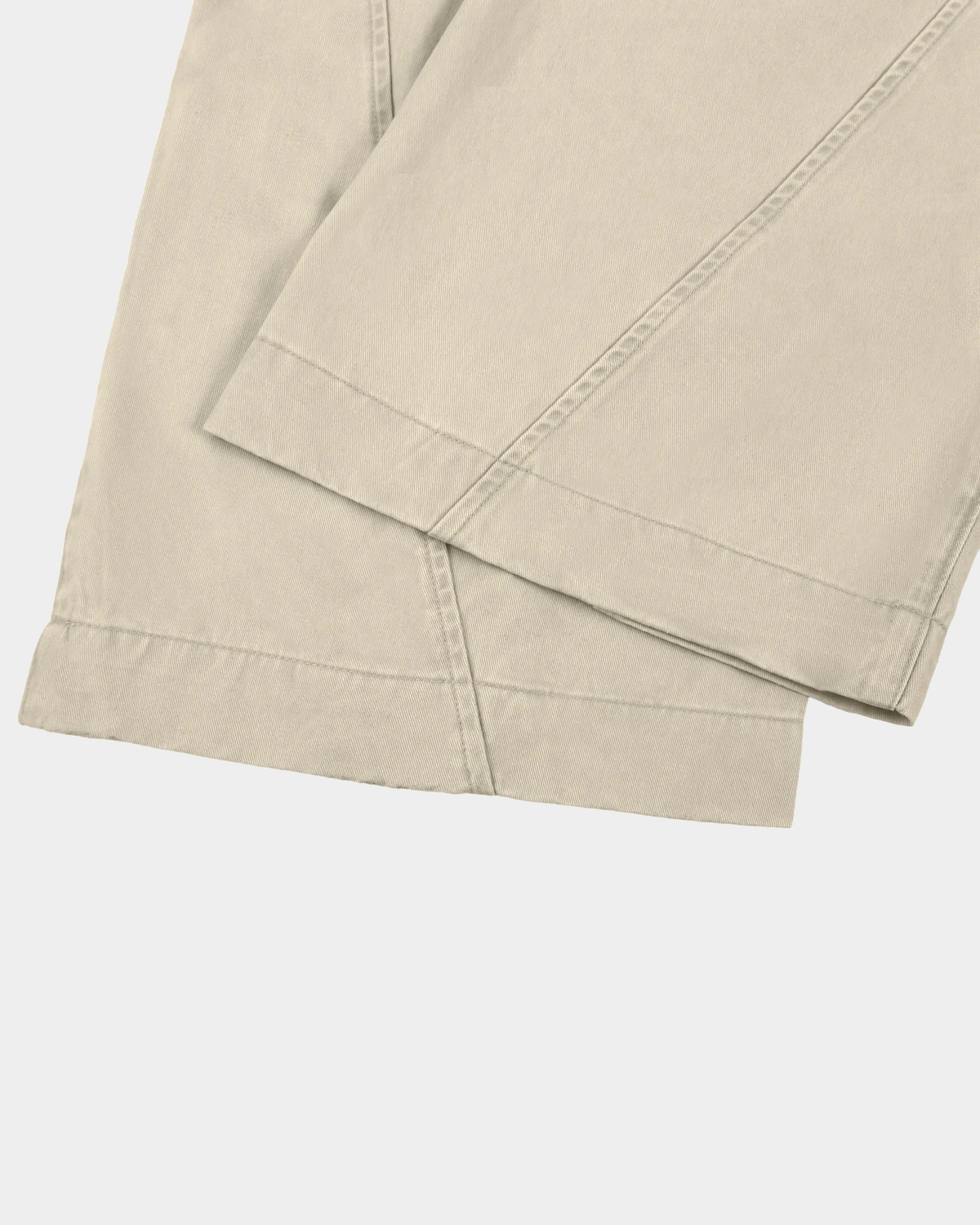 ODMPOD barrel leg trousers in neutral fabric, featuring a relaxed fit with tapered legs and stylish front pockets.