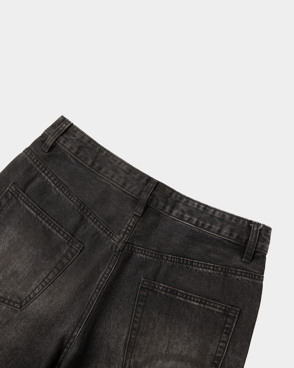 Kaleb A. Bearden washed denim pants with a relaxed fit and classic blue color, showcasing the casual, stylish design.