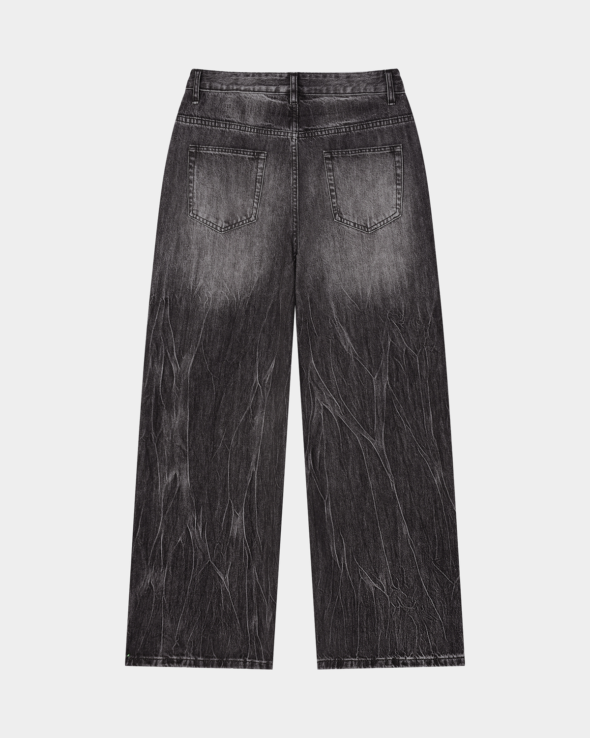 ODMPOD streaked wide-leg jeans showing high-waisted fit, distressed detailing, and relaxed silhouette on model.