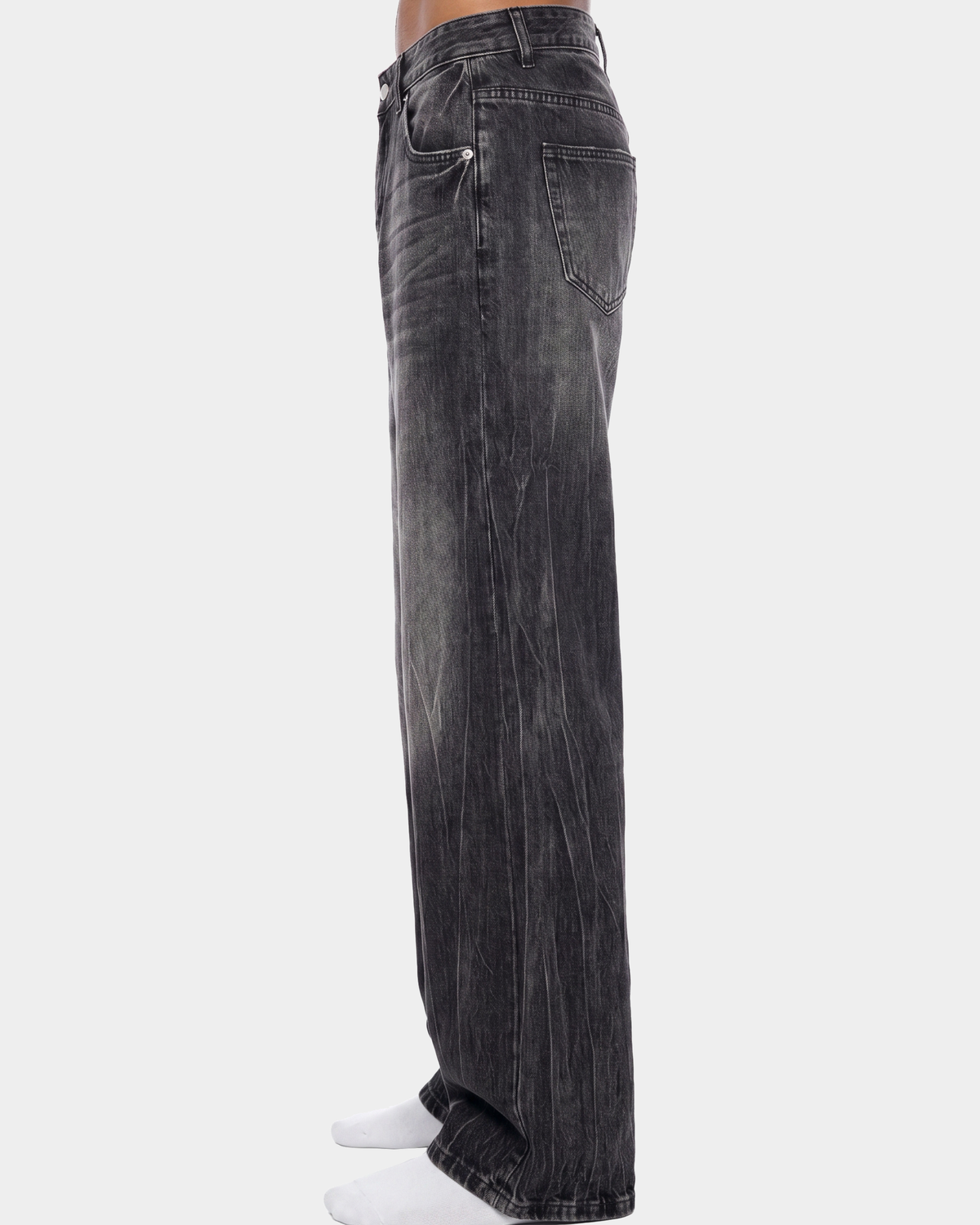 ODMPOD streaked wide leg jeans featuring a relaxed fit, high waist, and distressed detailing on light denim fabric.
