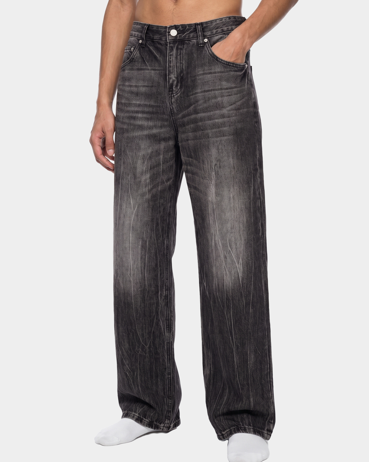 ODMPOD streaked wide-leg jeans featuring distressed details and a relaxed fit, showcased from a front view.