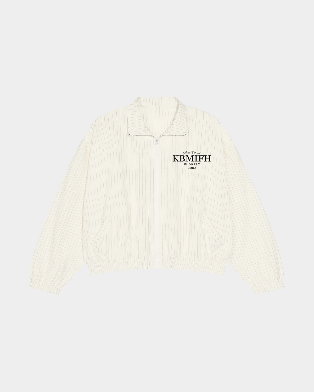 ODMPOD KBMIFH cream track jacket with zip front and sporty design, shown on a hanger against a plain background.
