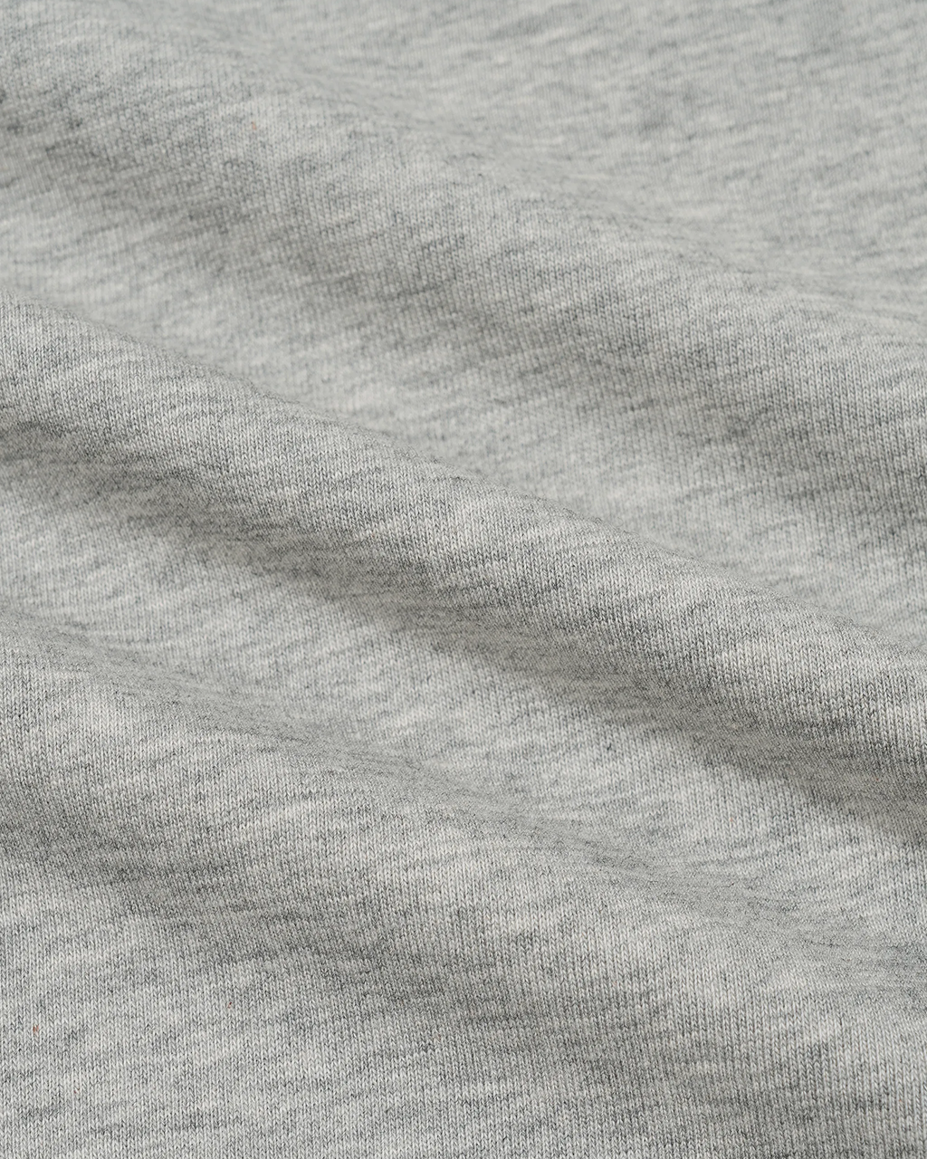 ODMPOD plaid panel short sleeve tee featuring a casual fit with a plaid pattern on the front and solid fabric on the sleeves.