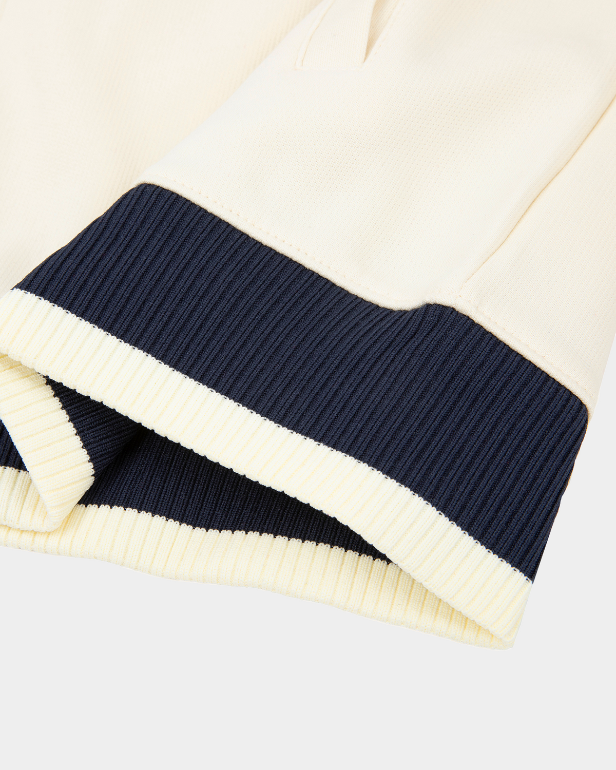 ODMPOD Home Blues Track Jacket in navy with white stripes, featuring a sporty design and zip-up front.