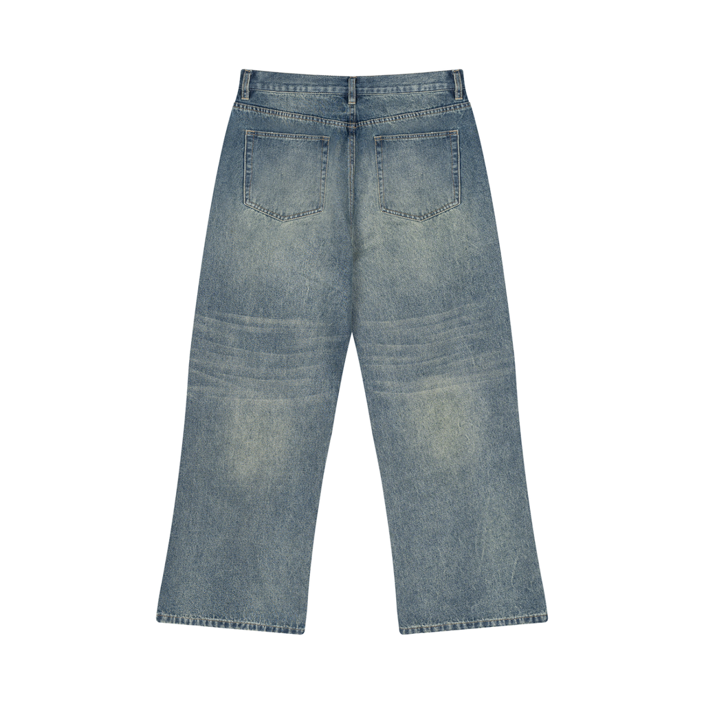 ODMPOD Sunfade Wide Leg Jean showcasing light wash denim with a relaxed fit and wide-leg style.