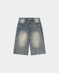 ODMPOD KAB Washed Denim Shorts, casual blue denim shorts with distressed details and a relaxed fit, shown on model.