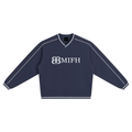 ODMPOD Monogram Raglan Pullover featuring a stylish monogram design on a comfortable, casual sweatshirt.