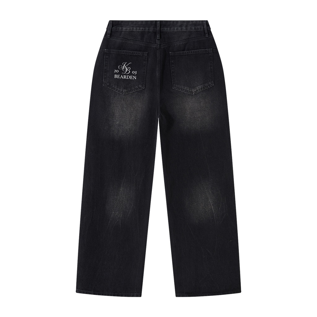 Faded black wide-leg jeans by ODMPOD displayed on a hanger, showcasing relaxed fit and stylish casual denim.
