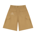 Odmpod cotton cargo shorts with multiple pockets, beige color, and relaxed fit, displayed on a hanger.