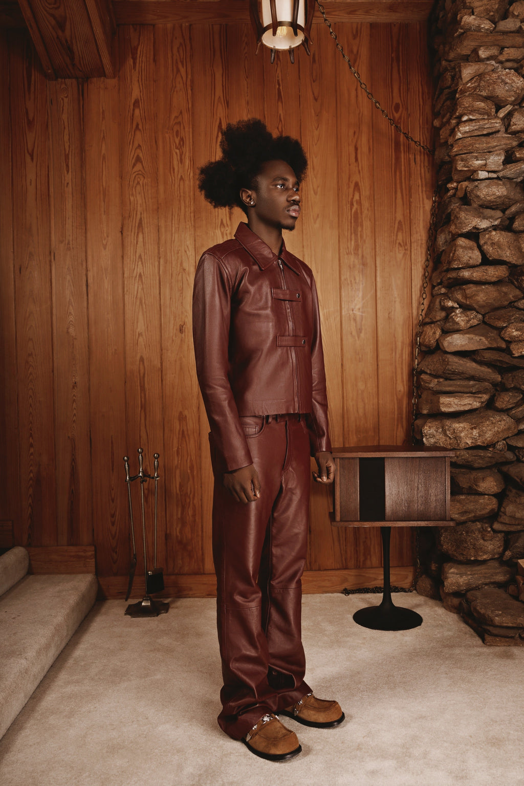 Maroon strap jacket by Kaleb A. Bearden featuring a stylish design with adjustable straps and a fitted silhouette.