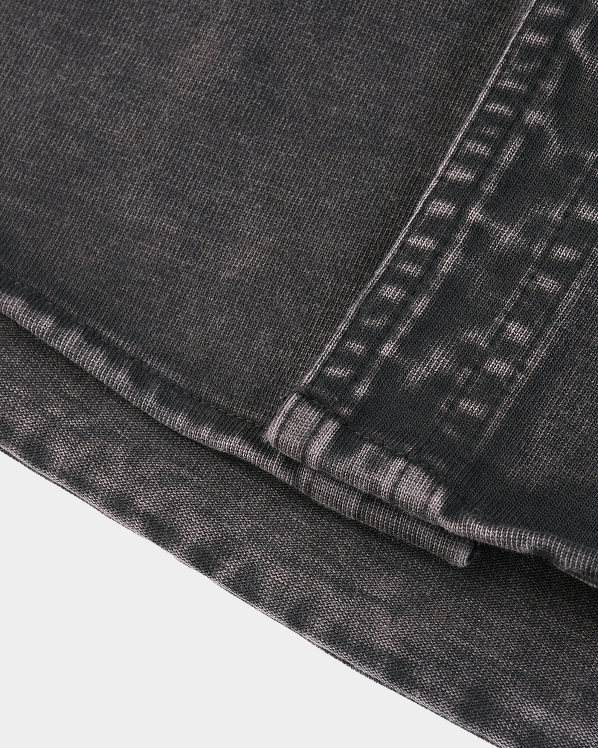 Kaleb A. Bearden Monogram Washed Denim Overshirt hanging on a rack with a classic washed denim look and subtle monogram details.