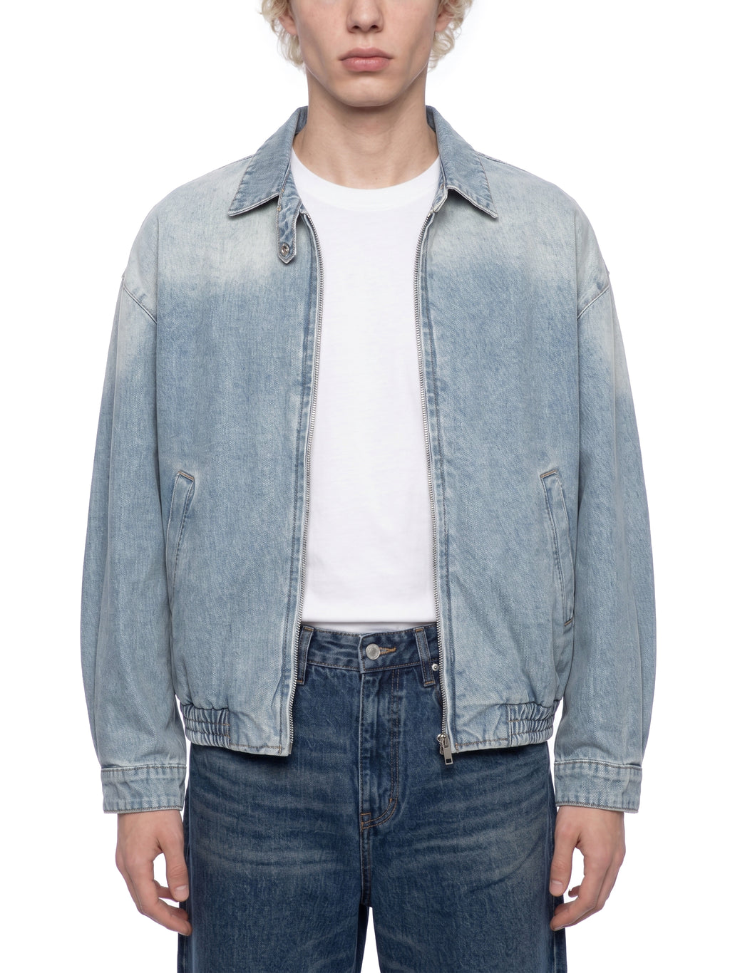 ODMPOD KAB Washed Blouson in light denim, featuring a relaxed fit and casual style, displayed on a hanger against a white background.