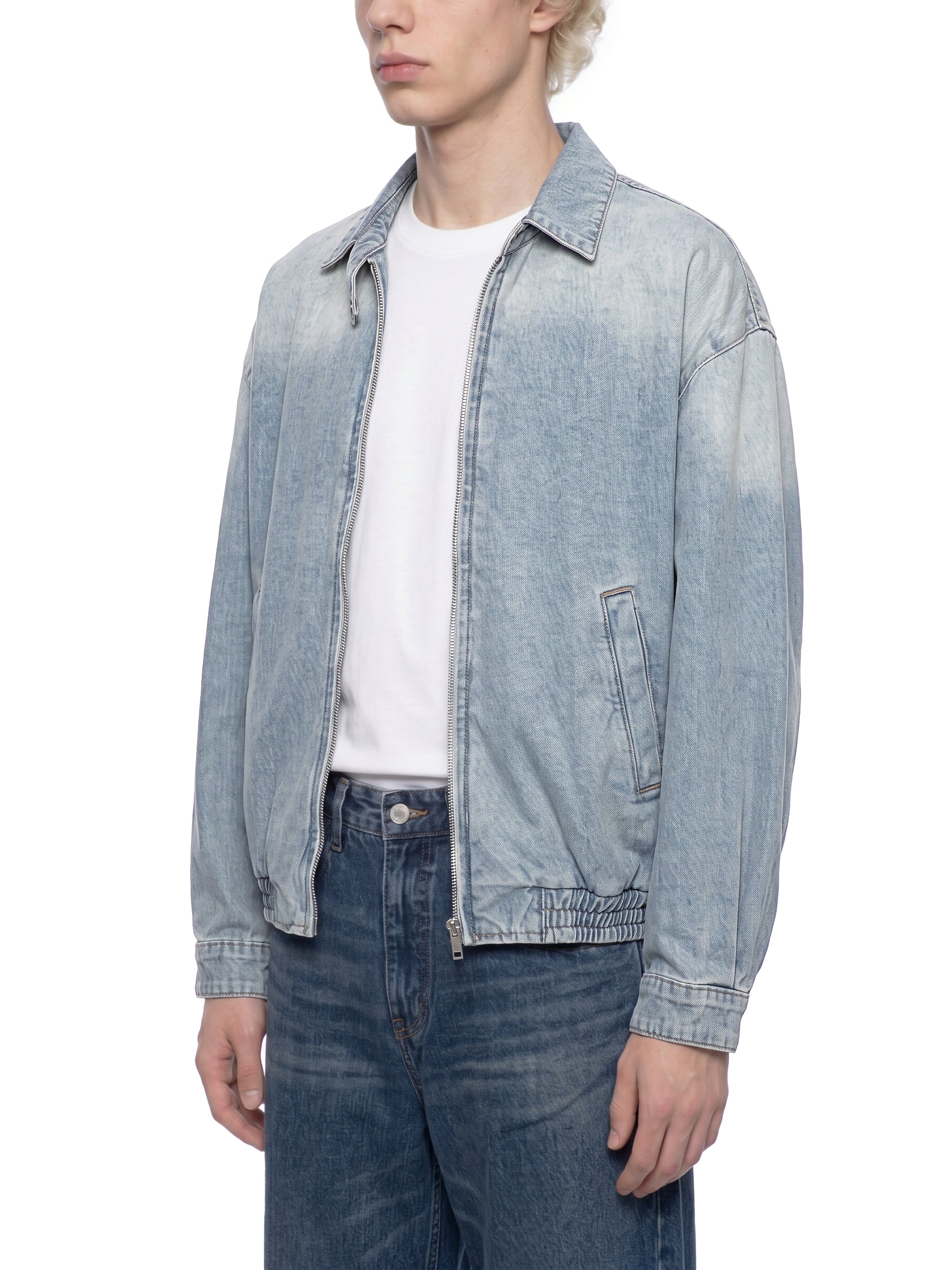 ODMPOD KAB Washed Blouson, lightweight casual jacket with washed fabric, front pockets, and adjustable cuffs, displayed on a hanger.