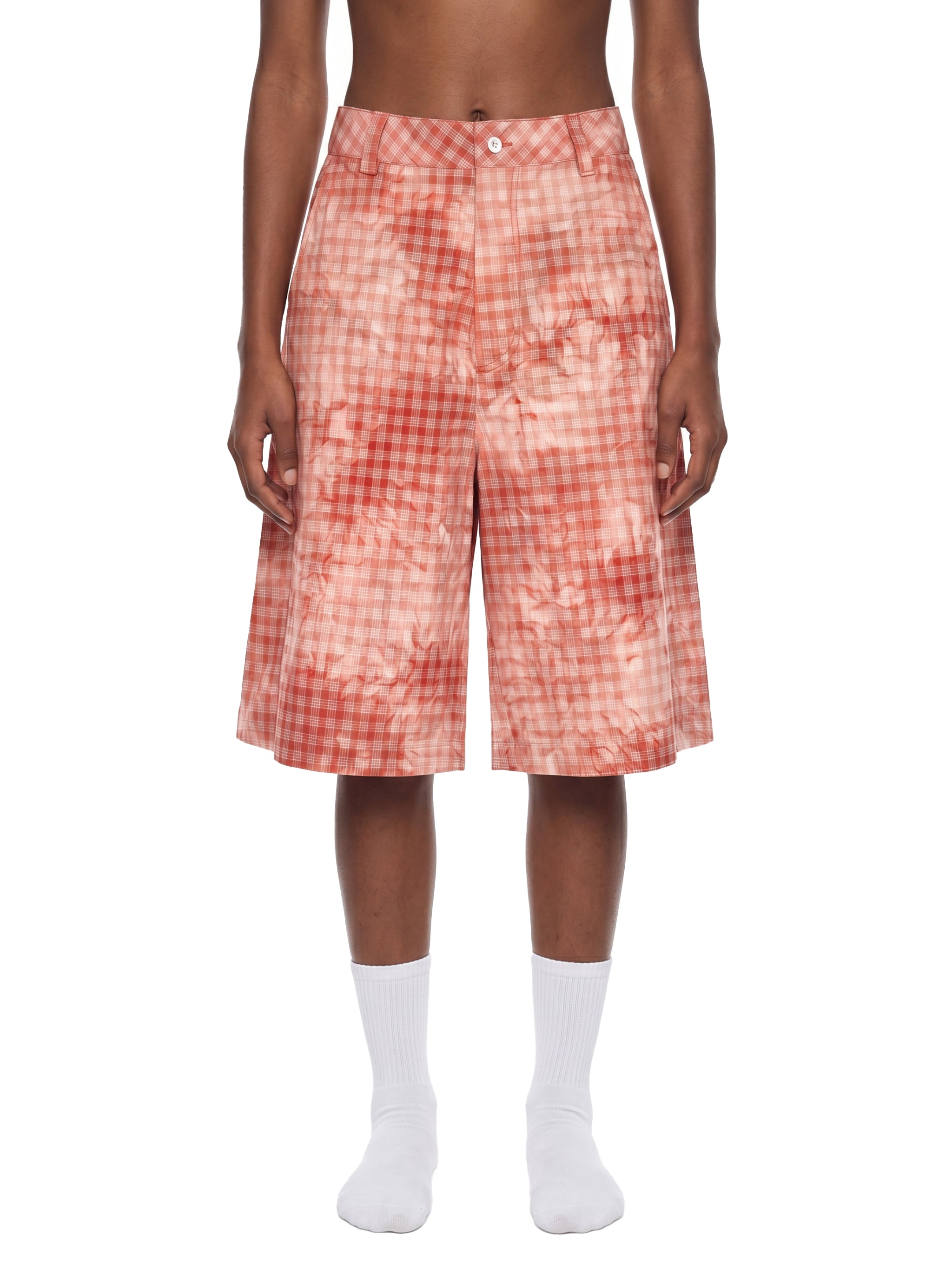 ODMPOD terracotta plaid shorts showing a relaxed fit with a vibrant checkered pattern and casual style.