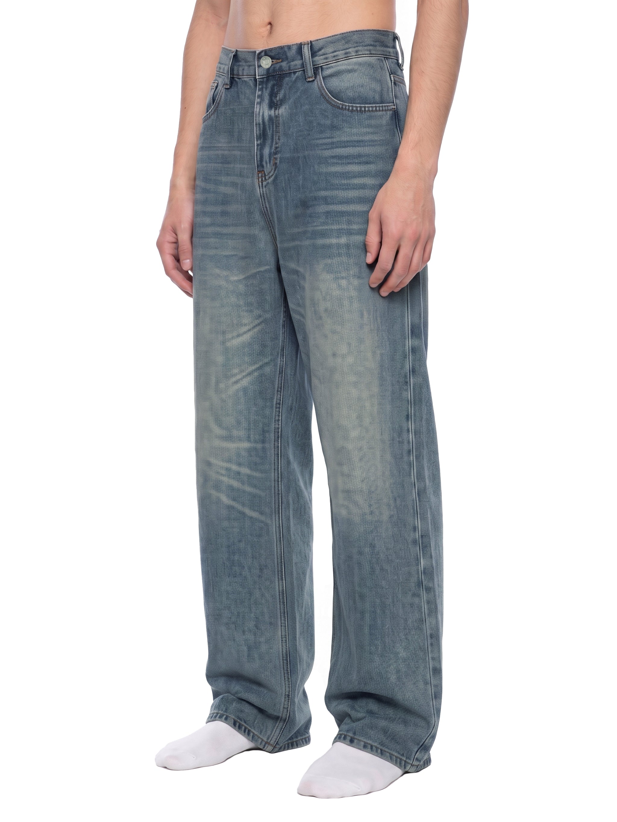 ODMPOD Sunfade wide leg jeans, denim pants with a relaxed fit and sun-faded wash, displayed on a model.