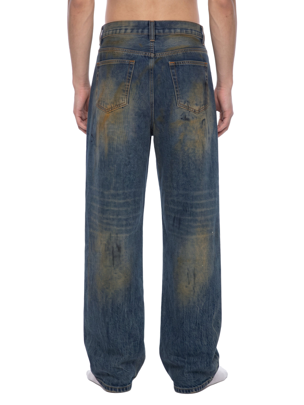 ODMPOD Mud Wash Wide Airfield Jeans showing relaxed fit, faded denim, and wide-leg cut on a plain background.