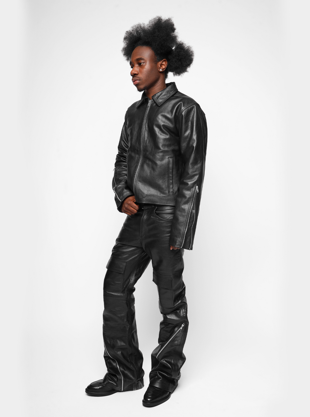 Kaleb A. Bearden zipped leather cargo pants showing the front view with zipper details and multiple cargo pockets.