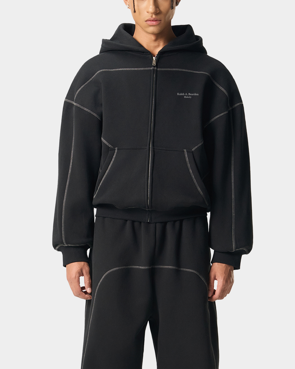 Black and white contrast hoodie by Kaleb A. Bearden featuring a stylish design and comfortable fit, shown on a model.